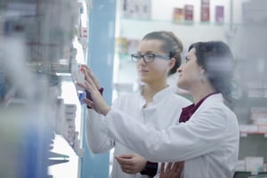 team of  pharmacist chemist woman group  standing in pharmacy drugstore