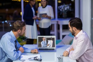 Businessmen having video conference in conference room at office