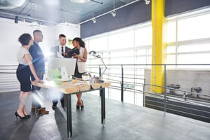 team of successful business people having a meeting in executive sunlit office-1